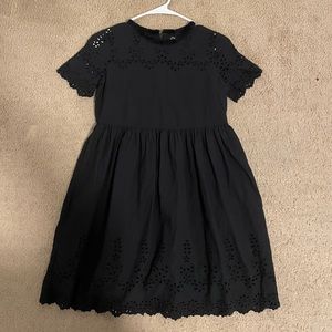 I am selling a black zip up dress.